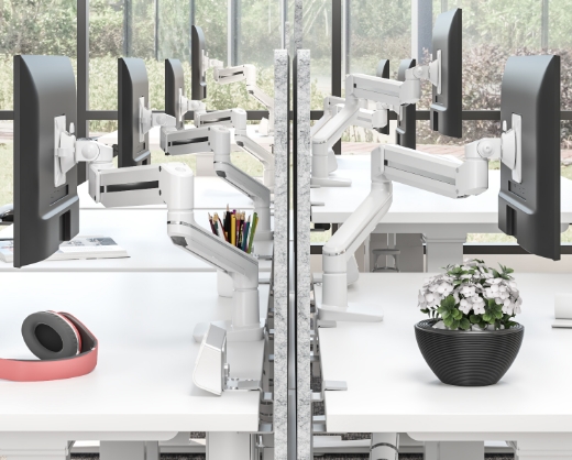 Image of a dual-arm monitor arm on a desk